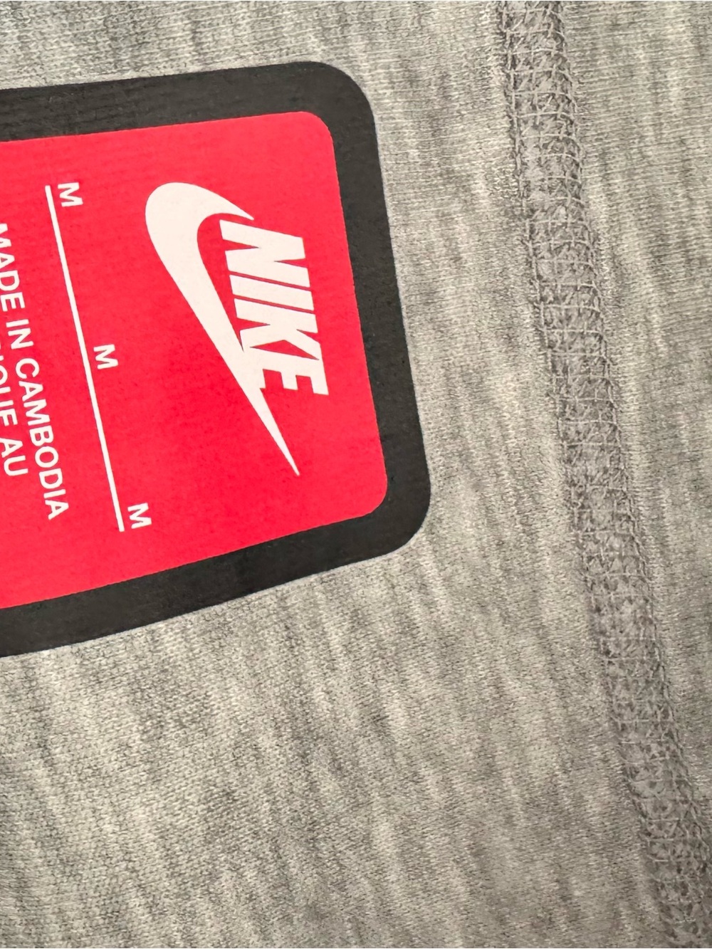 Nike Men's Heather Gray Athletic Shorts with Red Logo Tag